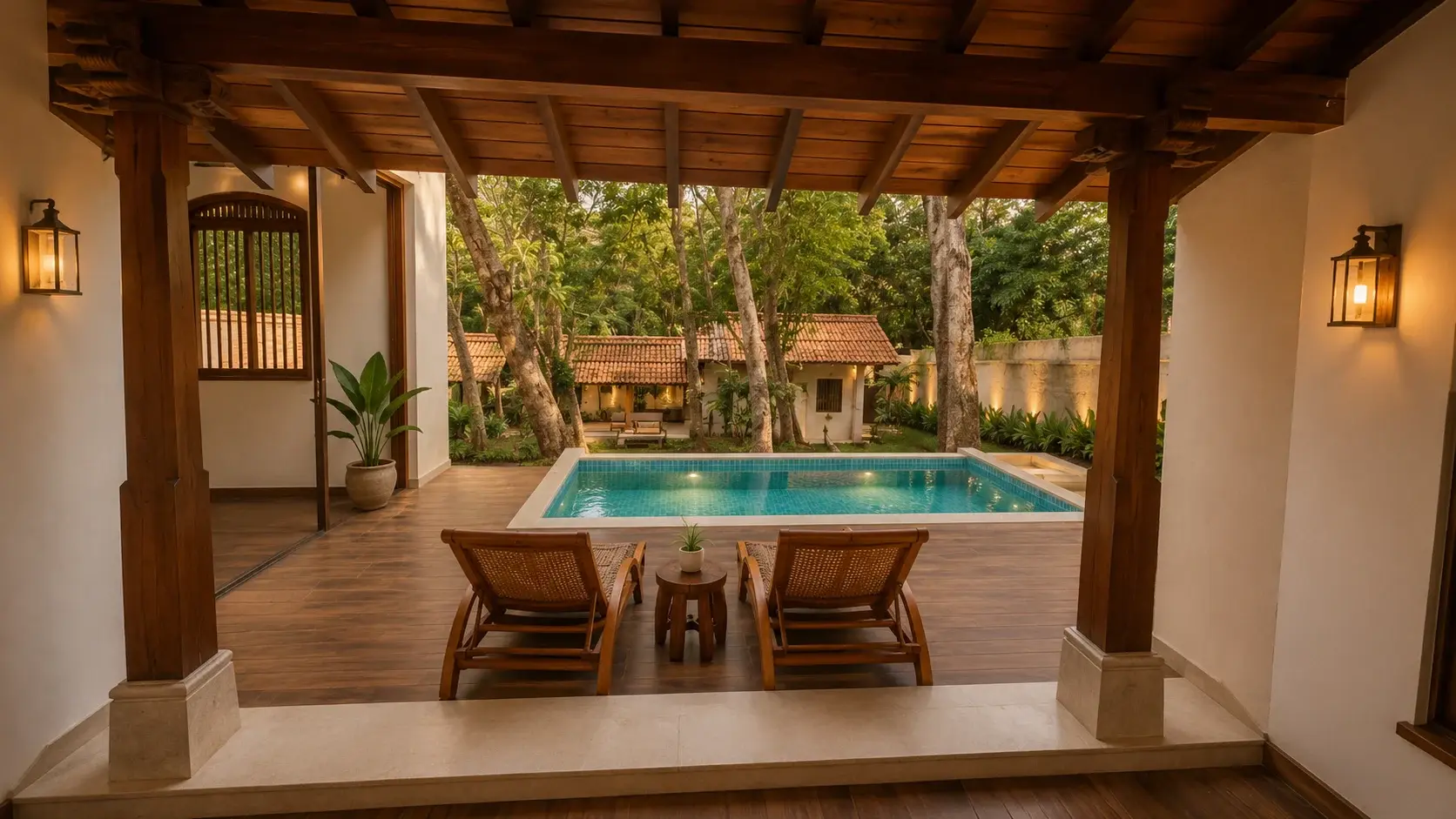 Covered veranda overlooking Villa Three's plunge pool at dusk
